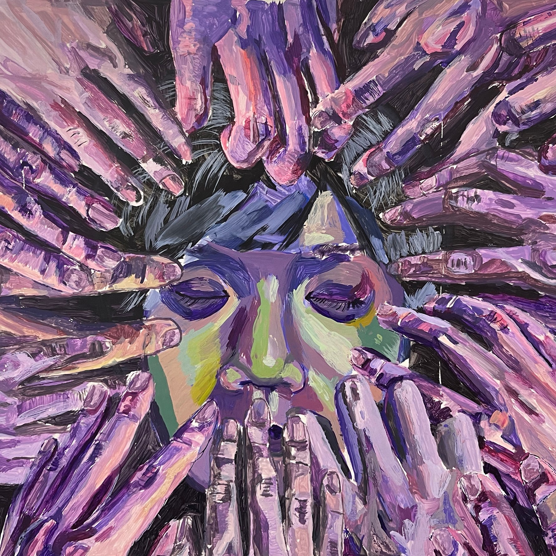 hands surrounding a face with closed eyes